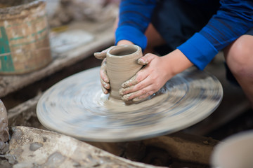 Fototapeta na wymiar boy molding ceramic pottery design