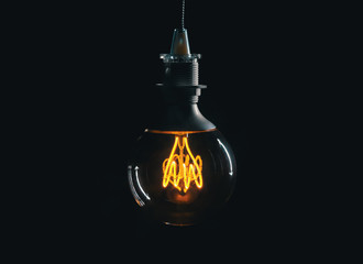 Vintage lightbulb on dark background