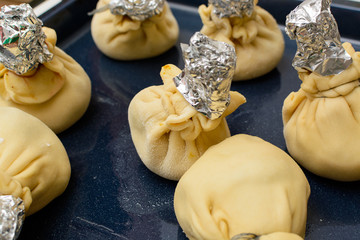 Chicken in puff pastry on the baking sheet
