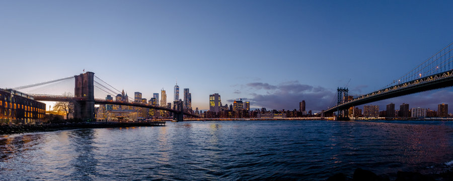 Panoramic view of Manhattan and Brooklyn Bridge at sunset - New York, USA © diegograndi