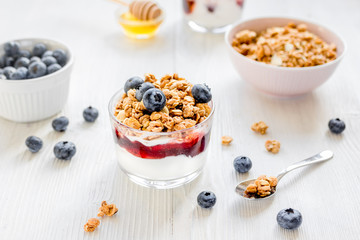 Healthy morning with granola breakfast on white kitchen table