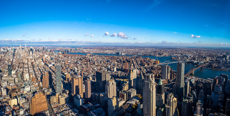 Skyline aerial view of Manhattan with skyscrapers, East River, Brooklyn Bridge and Manhattan Bridge - New York, USA