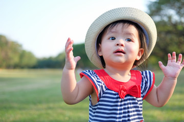 Cute Baby girl playing in the garden, close-up portrait, Portrait of a beautiful baby girl