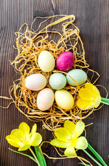 Easter concept eggs in nest top view close up