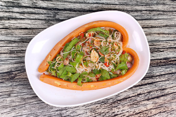 Sausage cheese wrap spicy sour vegetable salad with rice noodle .