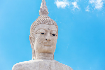 Fototapeta na wymiar big buddha statue with sky at Wat Phu Manorom Footprint temple, Thailand