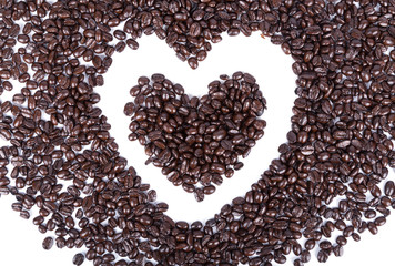 Coffee beans in shape of heart on white background