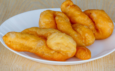 'patongko' thai and chinese food deep fried for breakfast on plate white