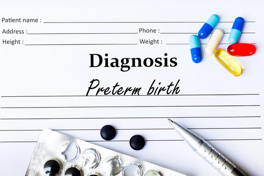 Preterm birth -  Diagnosis written on a piece of white paper with medication and Pills