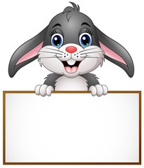 Cartoon bunny holding blank sign
