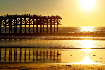 Tourists gather to watch the San Diego sunset over the Pacific Ocean in California.