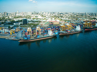 Fototapeta na wymiar Aerial view container and cargo ship, import export, business logistic supply chain transportation concept and crane at international Port for shipping cargo top view background