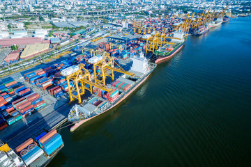 Aerial view container and cargo ship, import export, business logistic supply chain transportation concept and crane at international Port for shipping cargo top view background