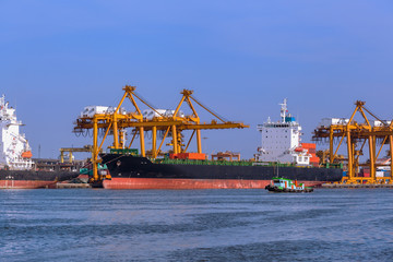 Naklejka premium Aerial view container and cargo ship, import export, business logistic supply chain transportation concept and crane at international Port for shipping cargo top view background