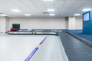 empty conveyor belt for carrying the passenger luggage or baggage claim at airport