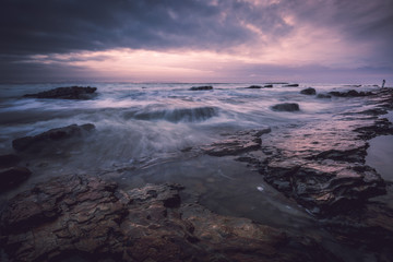 Soft, lovely glow illuminating on glistened rocks