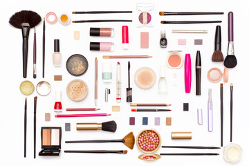 makeup cosmetics, brushes and accessories on white background. Top view.