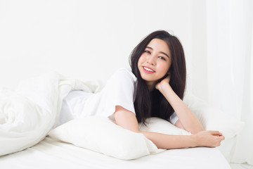 Young asian girl chilling on bed