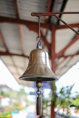 Shiny bell used to signal the train station