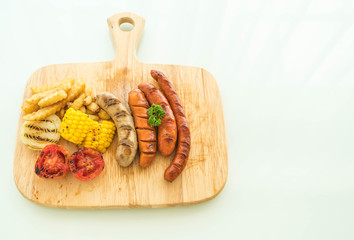 mix grilled sausage with vegetables and french fries