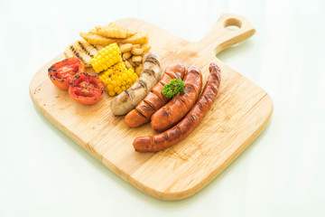 mix grilled sausage with vegetables and french fries