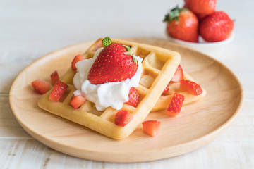waffle with strawberry on wood
