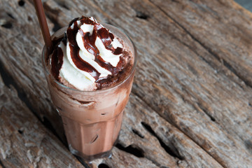 Ice chocolate with whipped cream on table