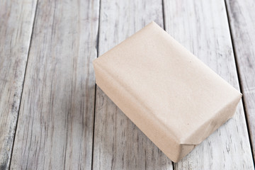 Cardboard box on a wooden background, Brown mail package parcel wrap delivery