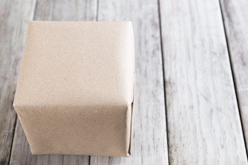 Cardboard box on a wooden background, Brown mail package parcel wrap delivery