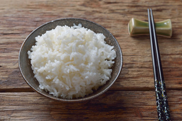 Bowl of Organic White Rice with chop sticks