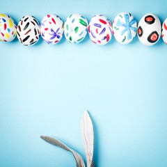 Easter bunny on a blue background. Rabbit. Easter ideas. Easter eggs. Space for text. Happy easter.