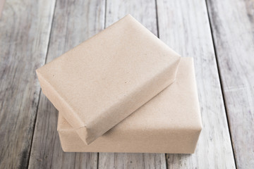 Cardboard box on a wooden background, Brown mail package parcel wrap delivery