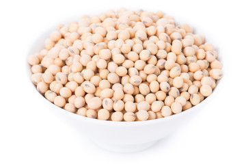 Soy beans in bowl on white