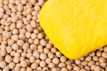 Macro shot of yellow tofu and soy beans