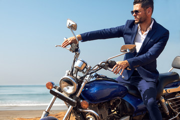 Man on motorcycle in suite