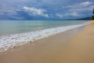 Fototapeta na wymiar sandy beach and stormy sky