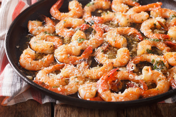 Shrimp with garlic, parmesan and herbs closeup. horizontal