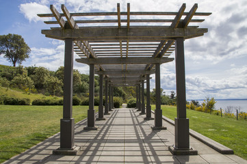 Wooden bower outside in the sunny day with sea on the background 