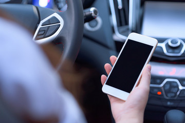 People using smart phone in car.