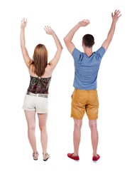 Back view of  joyful couple celebrating victory hands up. Rear view people collection. backside view of person. Isolated over white background. 
