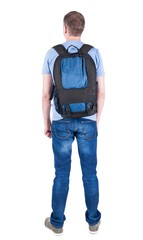 Fototapeta premium Back view of man with backpack looking up.