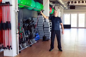Fototapeta premium Senior Caucasian Man Working Out At The Gym