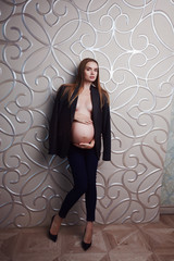 Very skinny vegetarian healthy pregnant women beautiful model in underwear at bright studio.