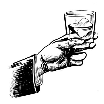Hand with glass of whiskey
