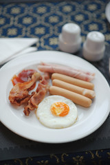 Fototapeta na wymiar English breakfast - fried egg bacon and toast.