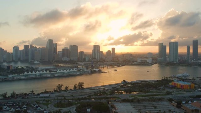 Miami Aerial v30 Flying low over Watson Island with cityscape views at sunset.