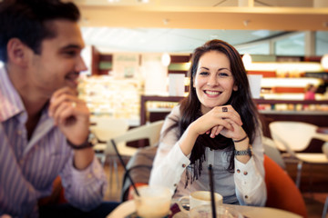 Young Couple Having Coffee In A Cafe