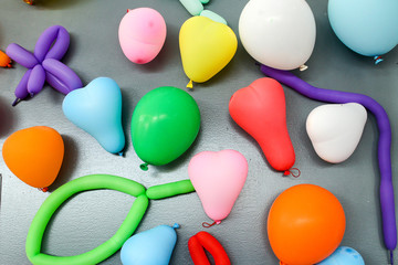 Balloons of many colours in a large pile