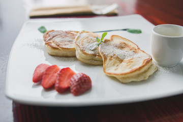 Hot pancake with strawberry and sauce - fritters of cottage cheese, taste breakfast