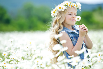 Little girl in a field of flowers 